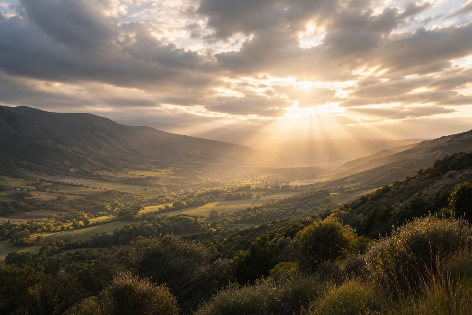 Soft light through clouds over a California valley